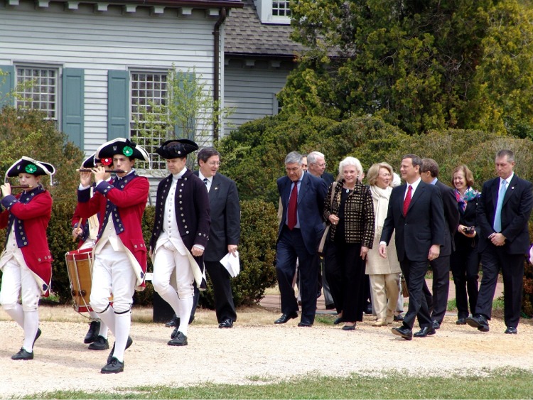 Dignitaries proceed to the tent for the ceremony